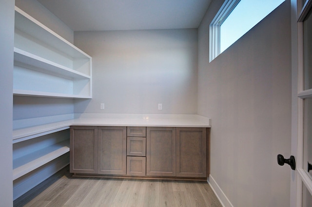 unfurnished office featuring light hardwood / wood-style flooring