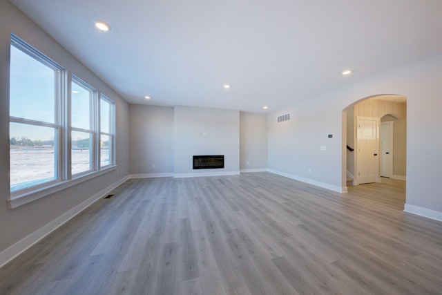 unfurnished living room with light wood-type flooring