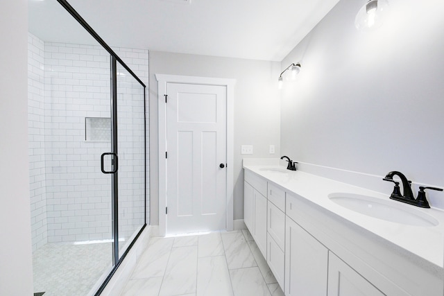 bathroom featuring vanity and a shower with door