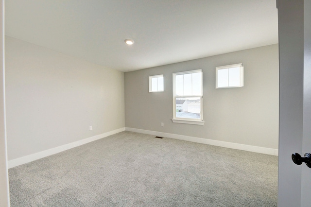 spare room featuring carpet flooring