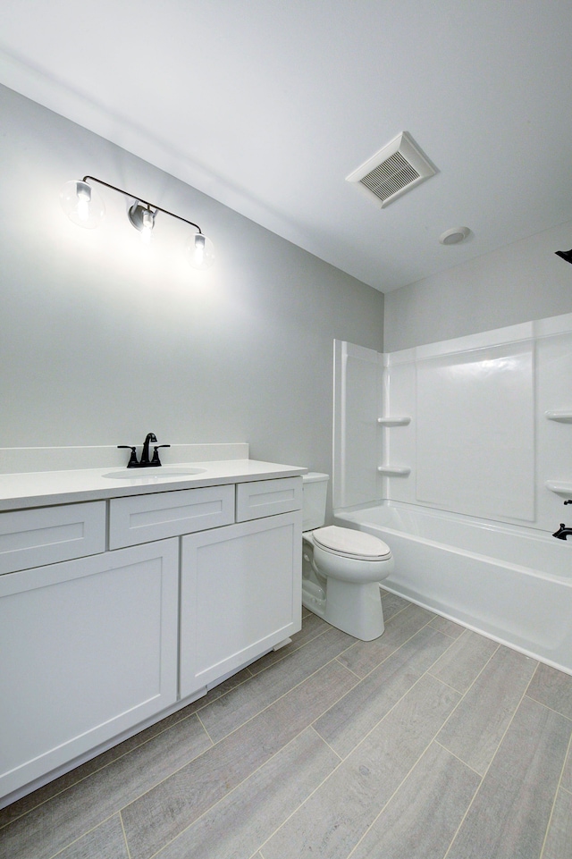 full bathroom with vanity, toilet, and tub / shower combination