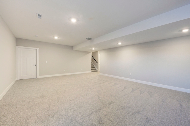 basement with light colored carpet