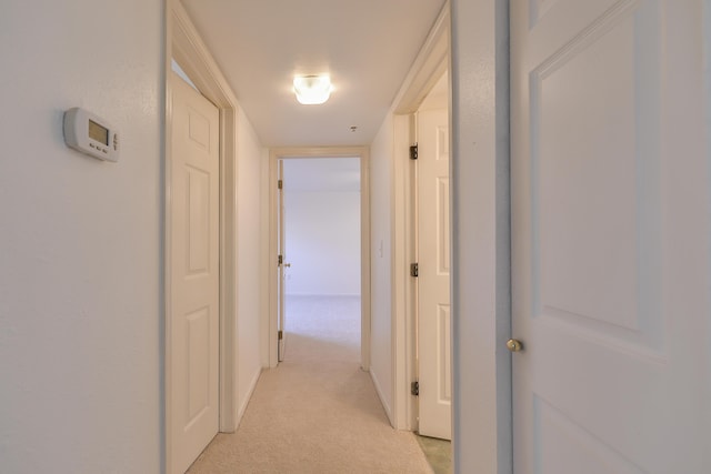 hallway with light carpet