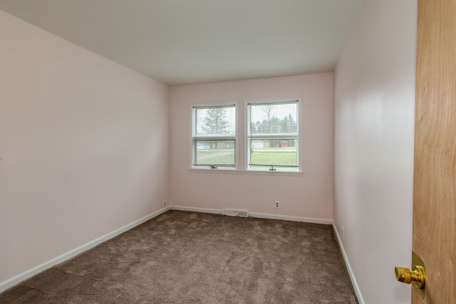 spare room with carpet floors