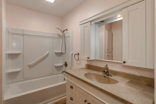 bathroom featuring shower / bathing tub combination and vanity