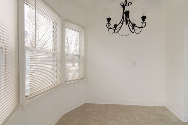 unfurnished dining area featuring light tile patterned flooring and an inviting chandelier