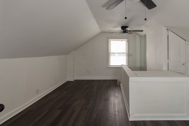 additional living space with ceiling fan, dark hardwood / wood-style floors, and lofted ceiling