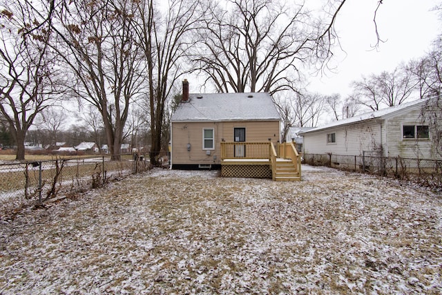 back of house with a wooden deck