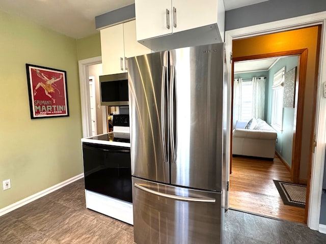 kitchen with appliances with stainless steel finishes and white cabinetry