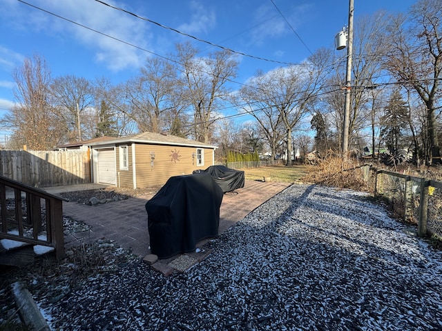 view of yard with an outbuilding and a patio