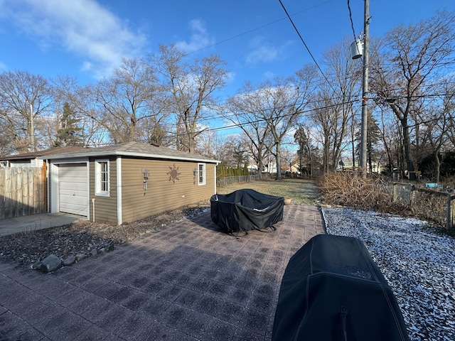 view of patio featuring area for grilling and a garage