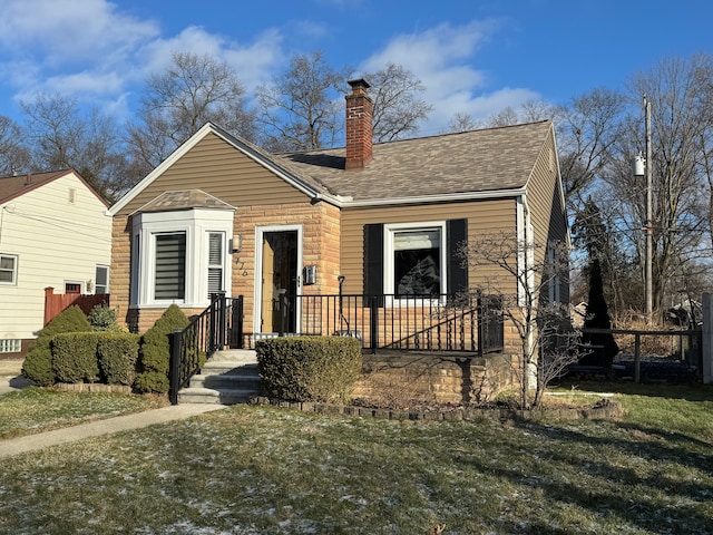 view of front of property with a front lawn