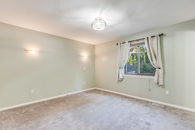 unfurnished room with carpet floors