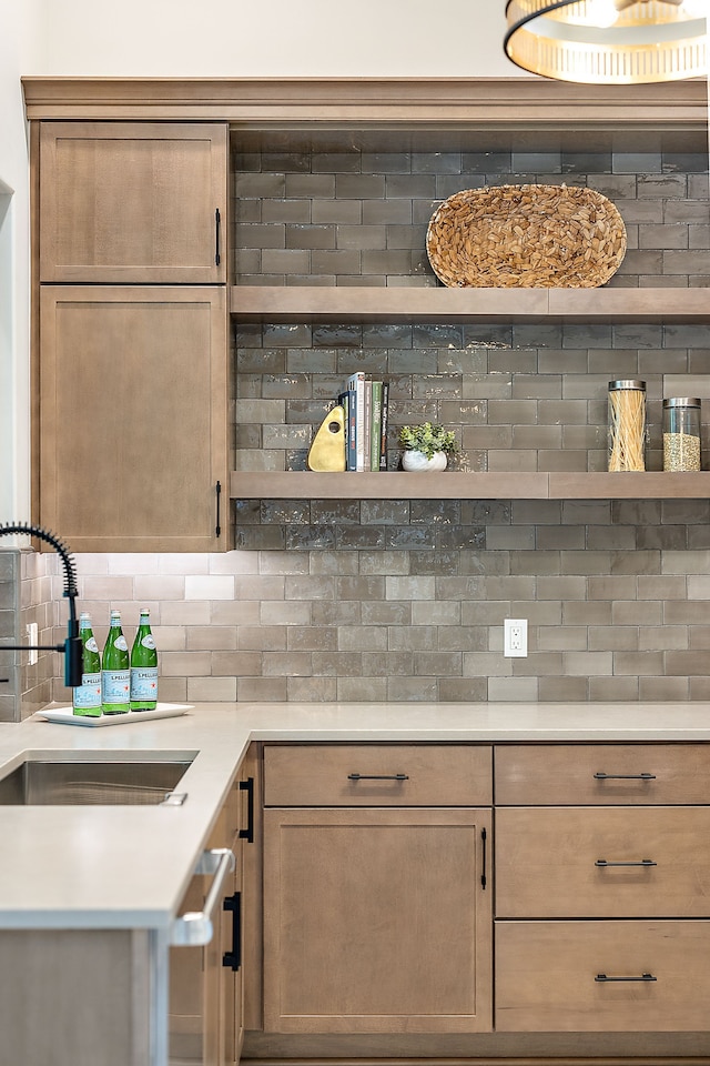 kitchen featuring tasteful backsplash and sink