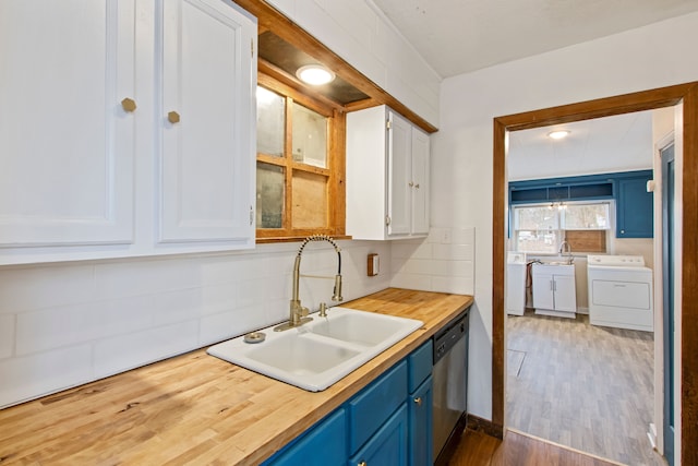 kitchen featuring stainless steel dishwasher, sink, blue cabinetry, dark hardwood / wood-style floors, and white cabinetry