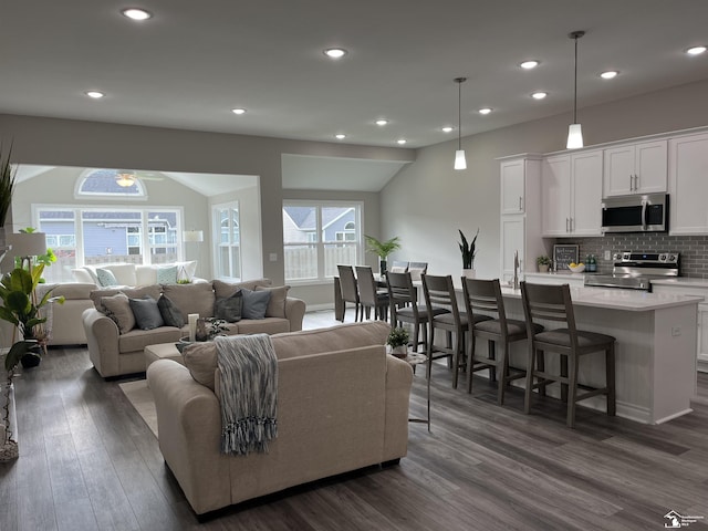 8289 Grande Lake Cir, Temperance, MI 48182 - living area featuring dark wood-style flooring, ceiling fan, and recessed lighting