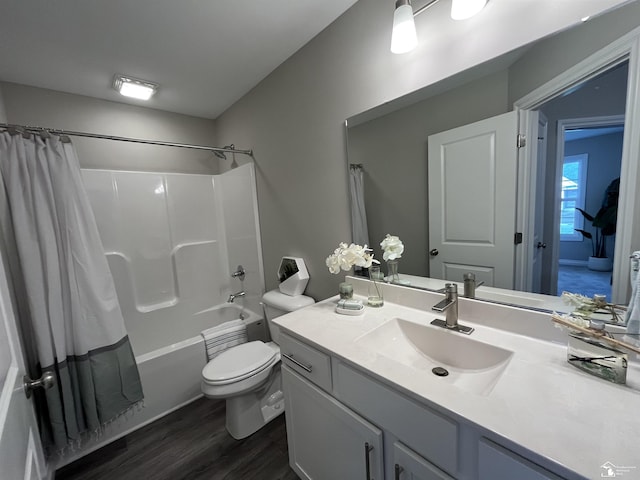 full bathroom with toilet, wood-type flooring, vanity, and shower / tub combo with curtain