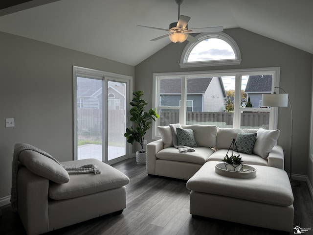 living room featuring dark hardwood / wood-style floors, vaulted ceiling, plenty of natural light, and ceiling fan