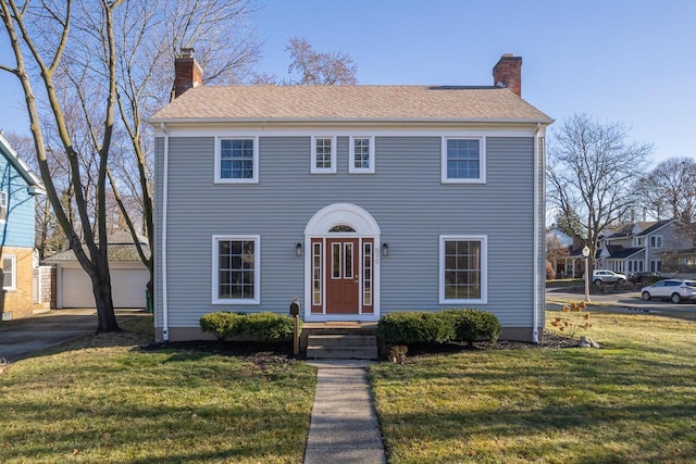 colonial inspired home with a front yard