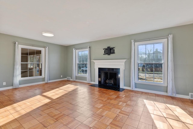 unfurnished living room with light parquet flooring