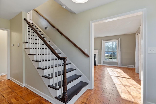 stairs with parquet flooring