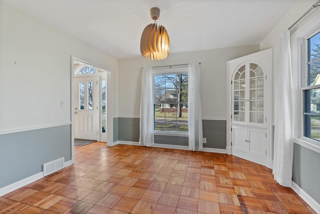 interior space with light parquet floors