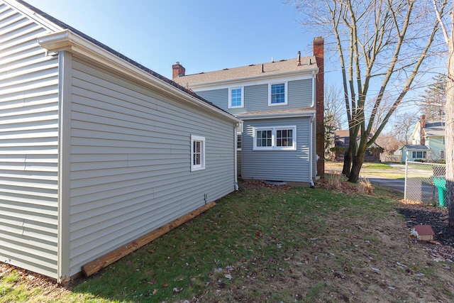 back of house featuring a yard