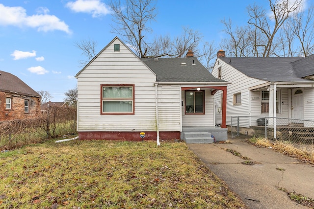 bungalow-style house with covered porch and a front lawn