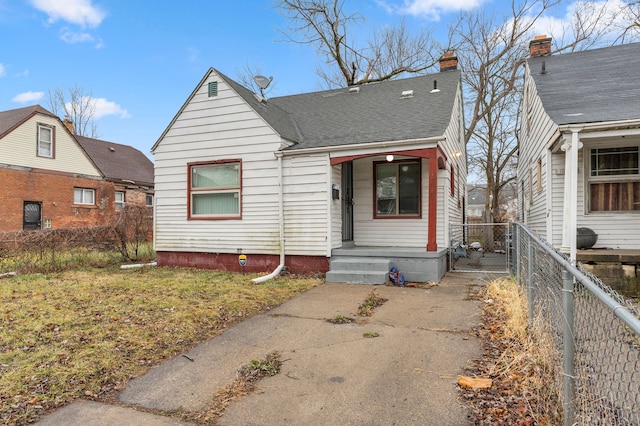 bungalow-style house with a front lawn