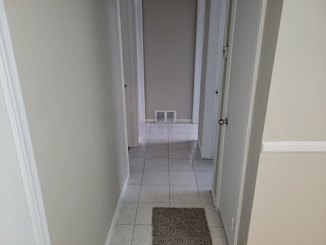 corridor featuring light tile patterned flooring