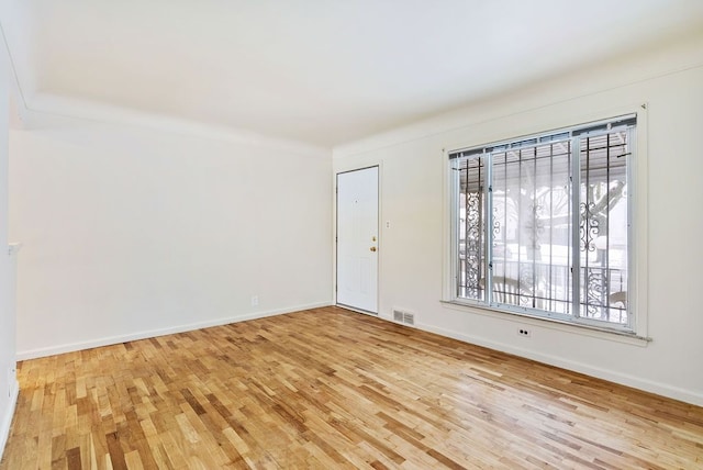 unfurnished room featuring light hardwood / wood-style flooring