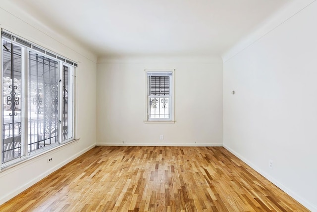 empty room with light hardwood / wood-style floors