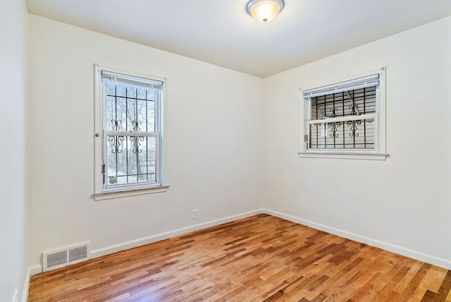 spare room featuring hardwood / wood-style floors