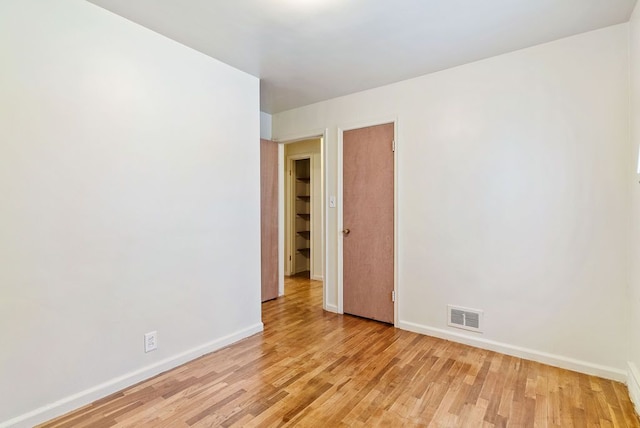 empty room with light wood-type flooring