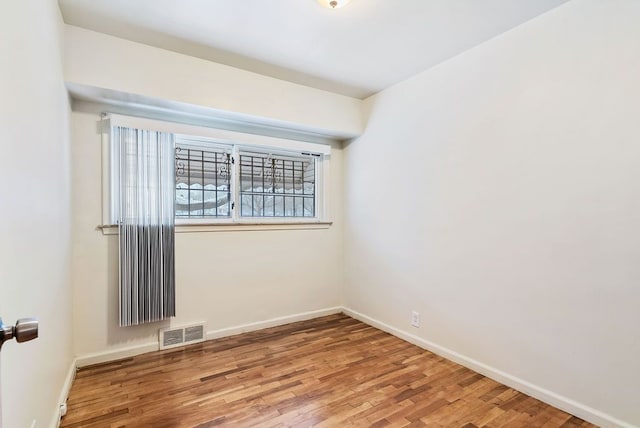 empty room featuring hardwood / wood-style flooring