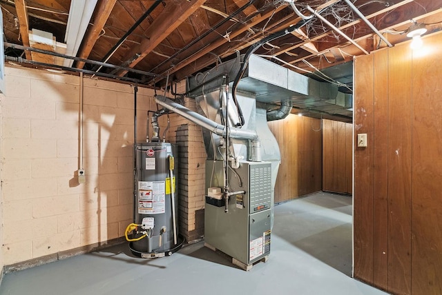 utility room with heating unit and gas water heater