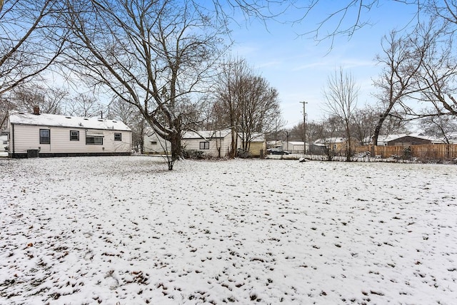 view of yard layered in snow