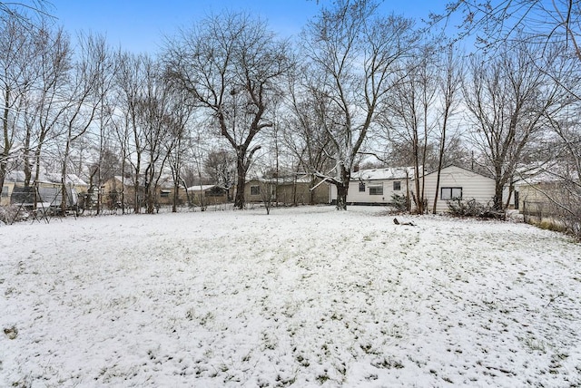 view of yard layered in snow