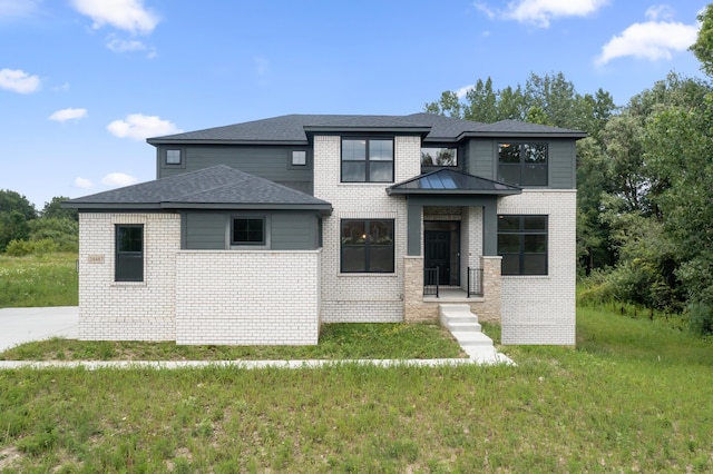 prairie-style house featuring a front yard