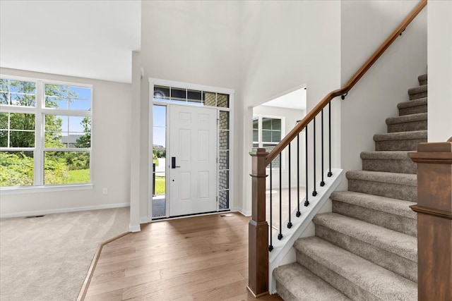 entryway with hardwood / wood-style flooring