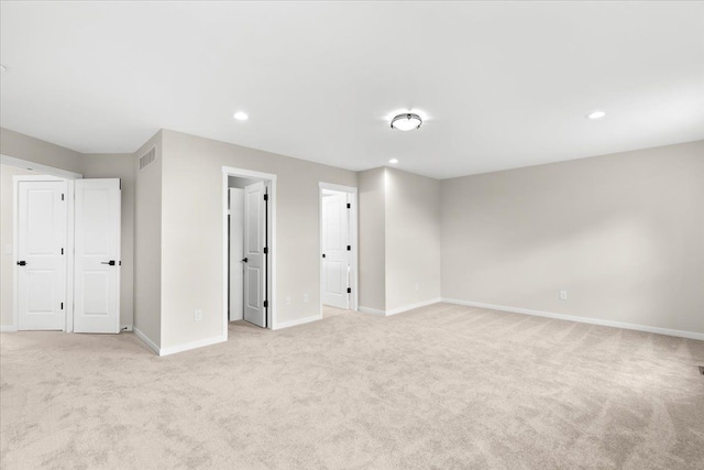 interior space featuring light colored carpet