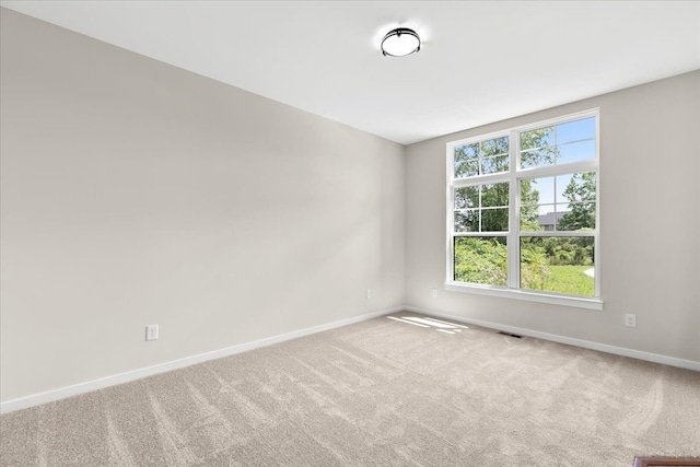 empty room with carpet flooring