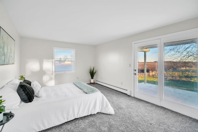 carpeted bedroom featuring access to exterior and a baseboard radiator