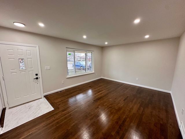 foyer featuring dark wood-type flooring