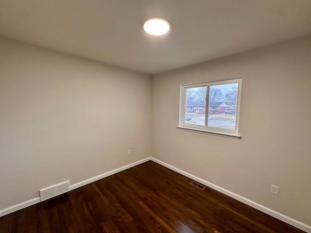 spare room featuring hardwood / wood-style floors