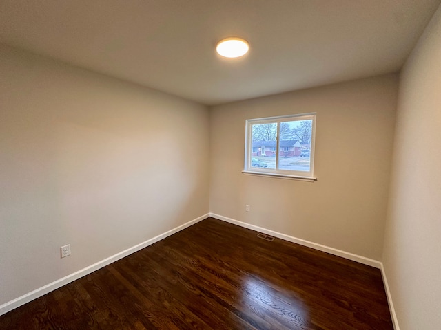 empty room featuring dark hardwood / wood-style floors