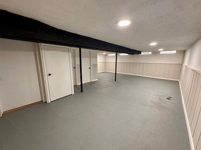 basement with a textured ceiling