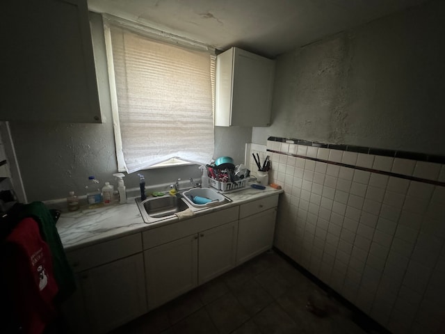 kitchen with sink and tile walls