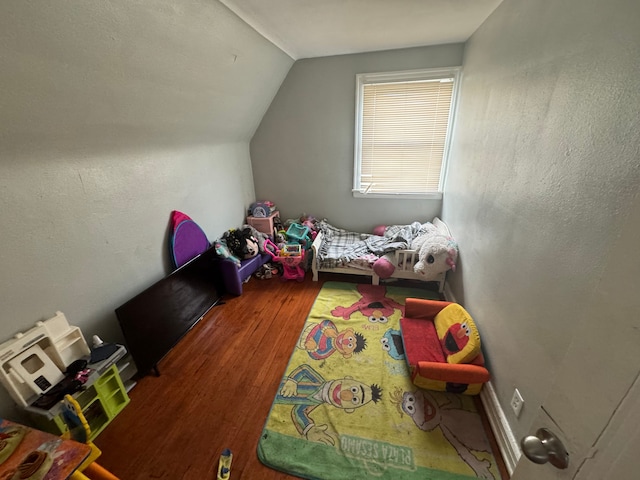 bonus room featuring hardwood / wood-style floors and lofted ceiling