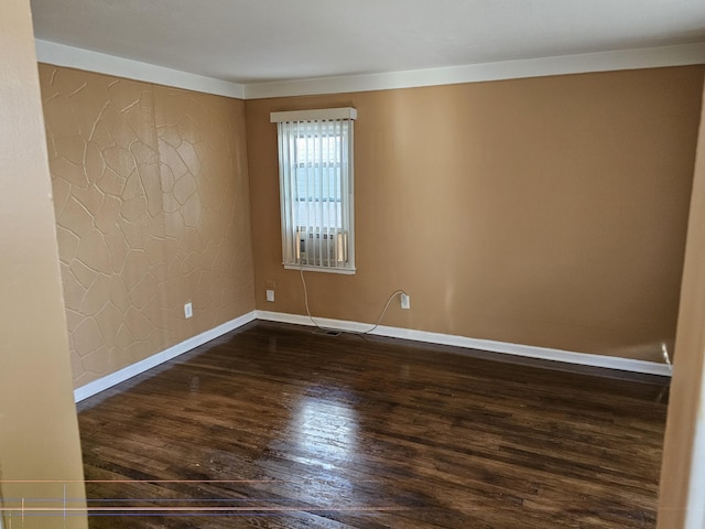 empty room featuring dark hardwood / wood-style flooring